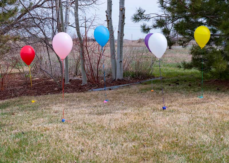 Easter eggs with balloons tied to them