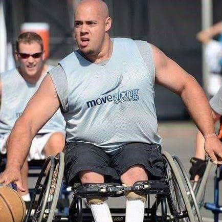 Eric playing wheelchair basketball