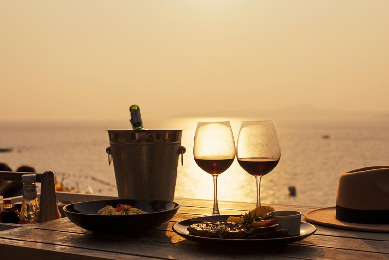 A romantic meal by the ocean sunset