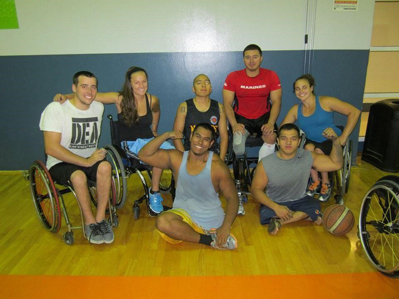 Megan Blunk, second from left, with her wheelchair basketball teammates