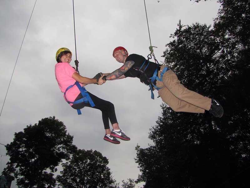 Jess on the zip-line with her husband