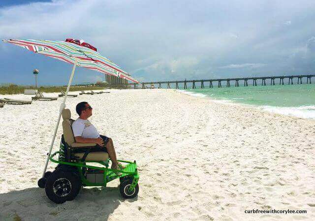 Cory Lee using a power beach wheelchair